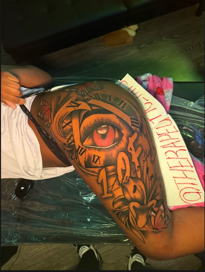 Realistic eye and lettering arm tattoo by Therapeutic Tats